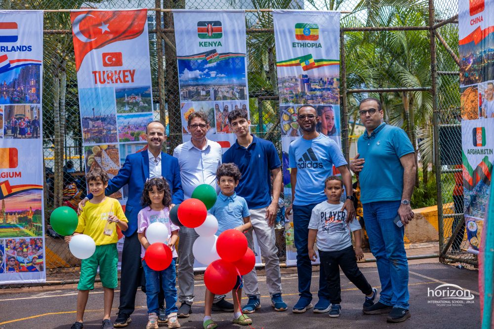 Families standing near country display banners